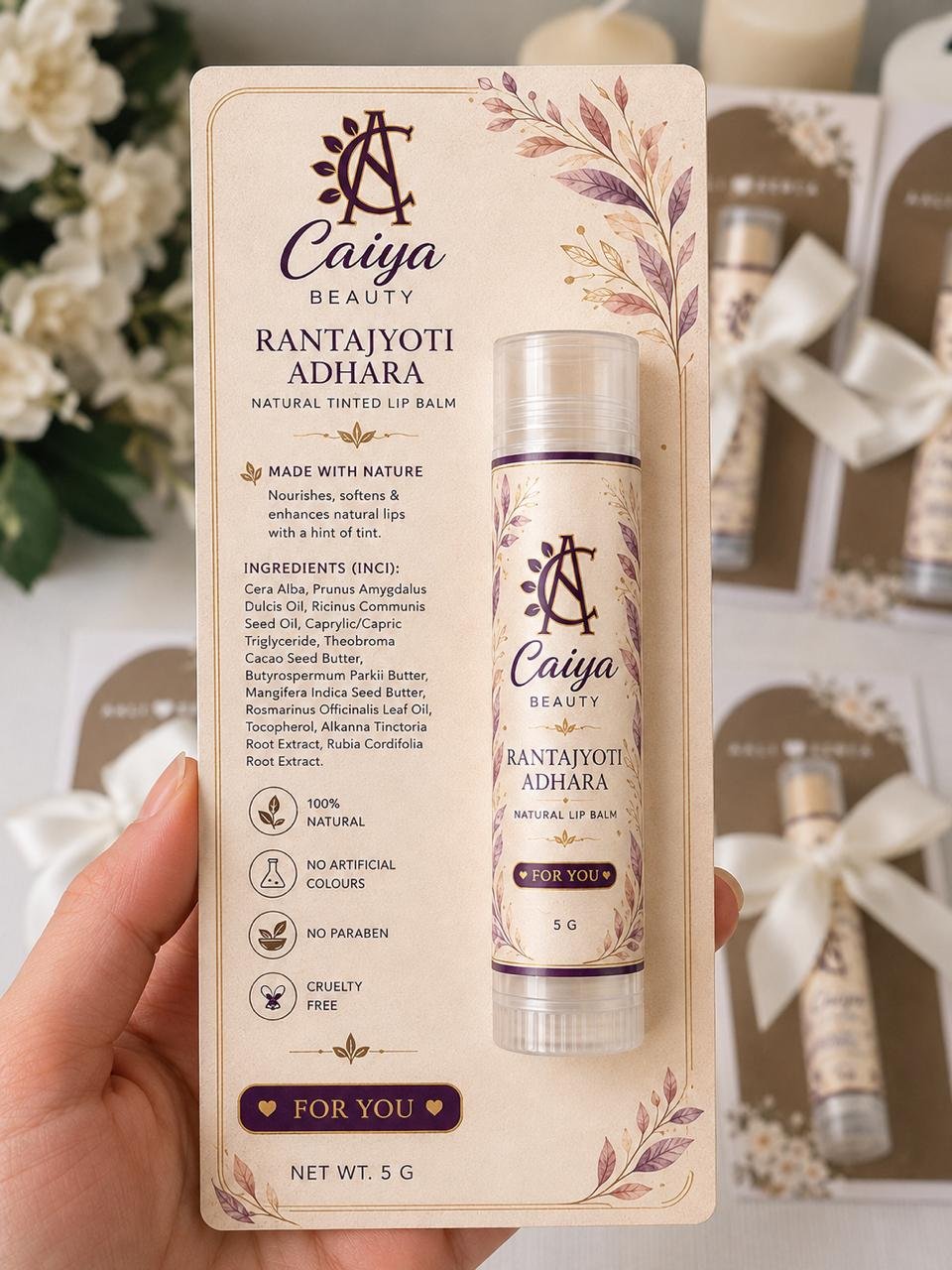 Hand holding the Rantajyoti Adhara lip balm gift pack